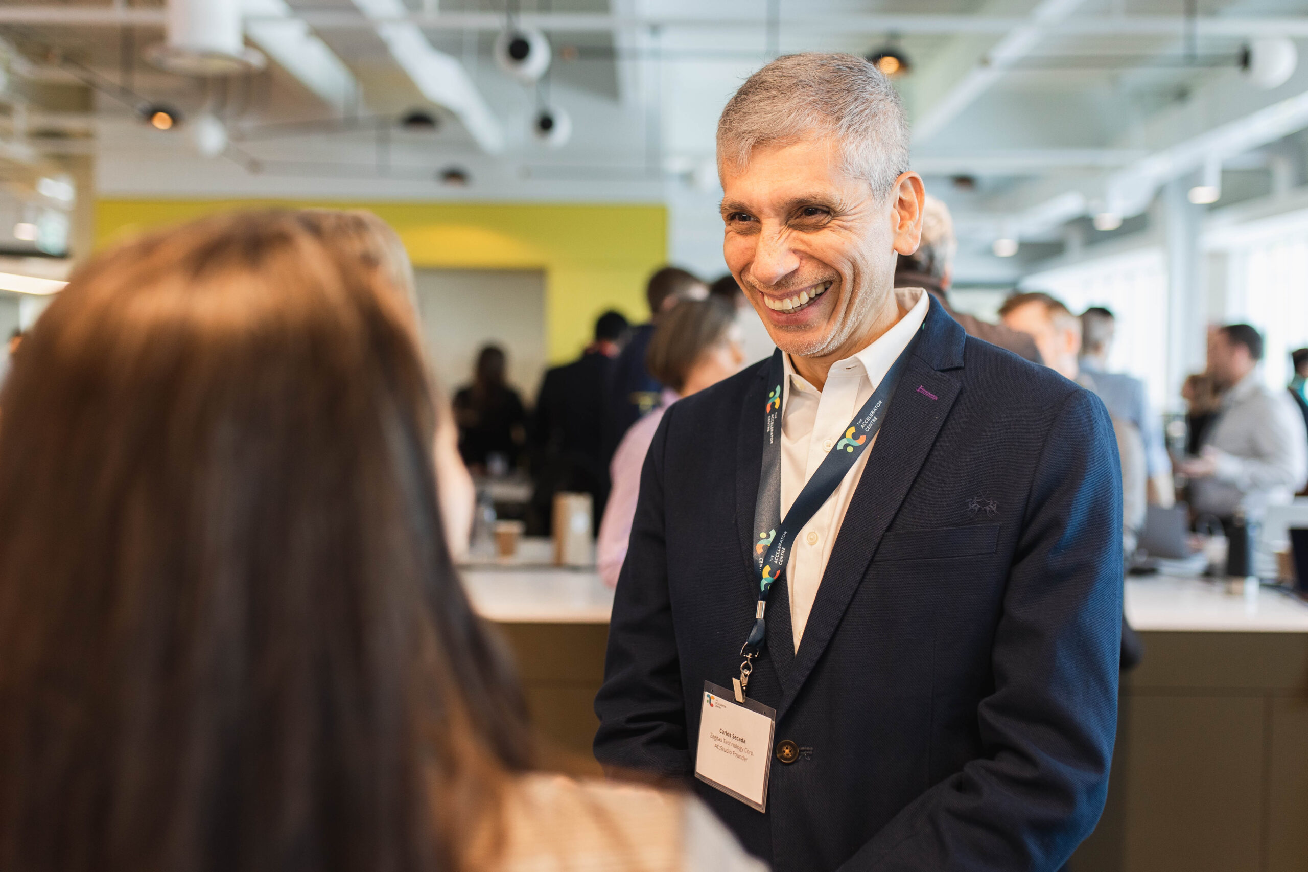 Founders smiling and socializing at our showcase.