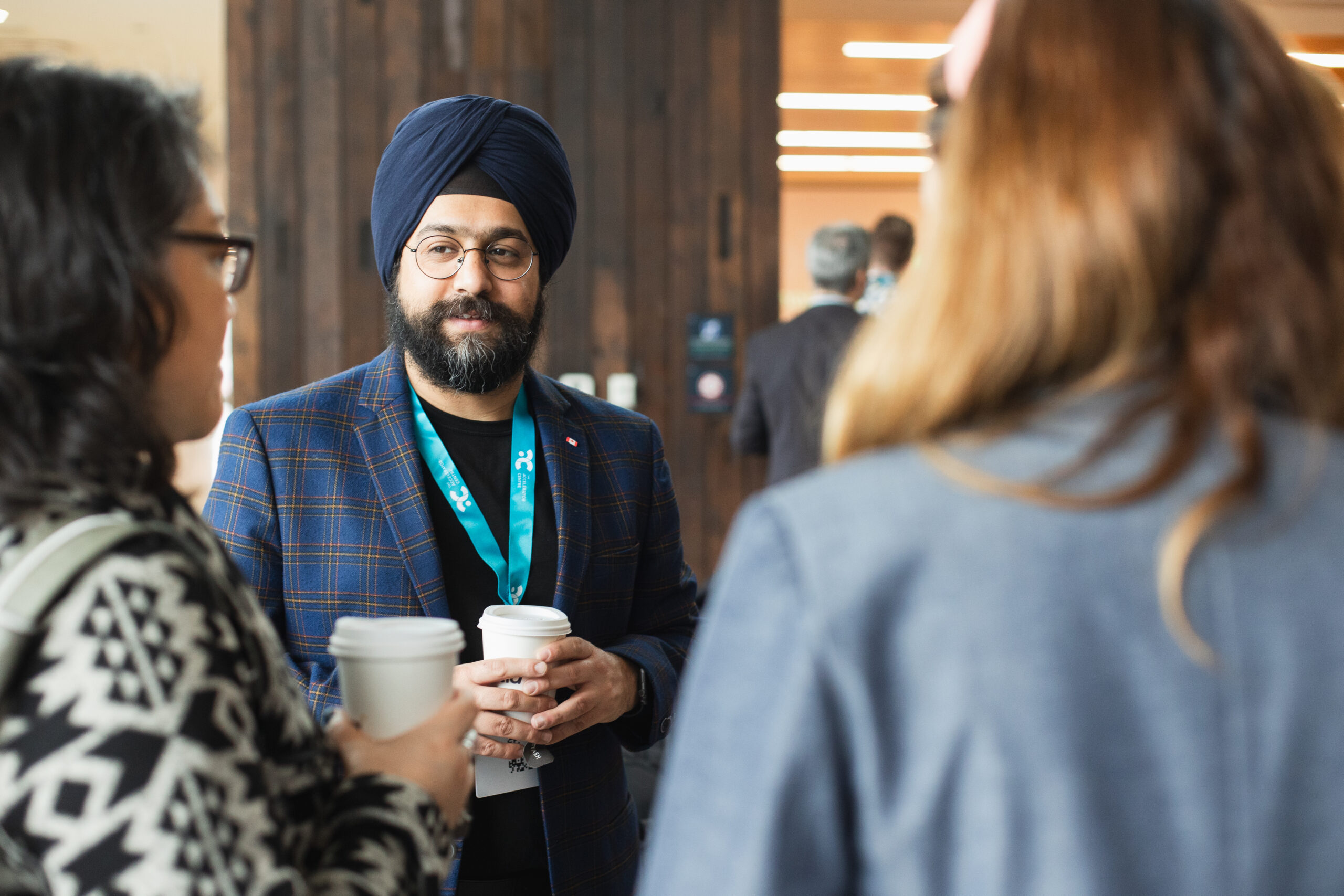 Our mentors talking at an event.