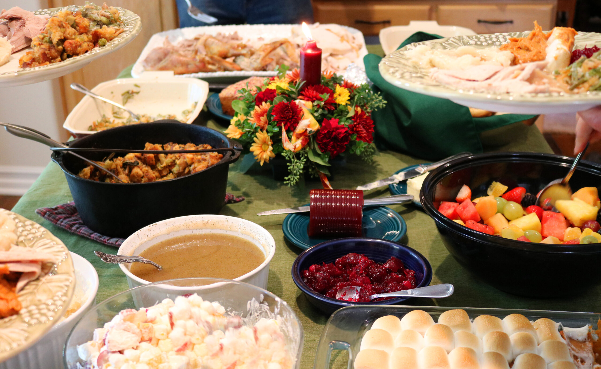Table filled with food for a potluck.
