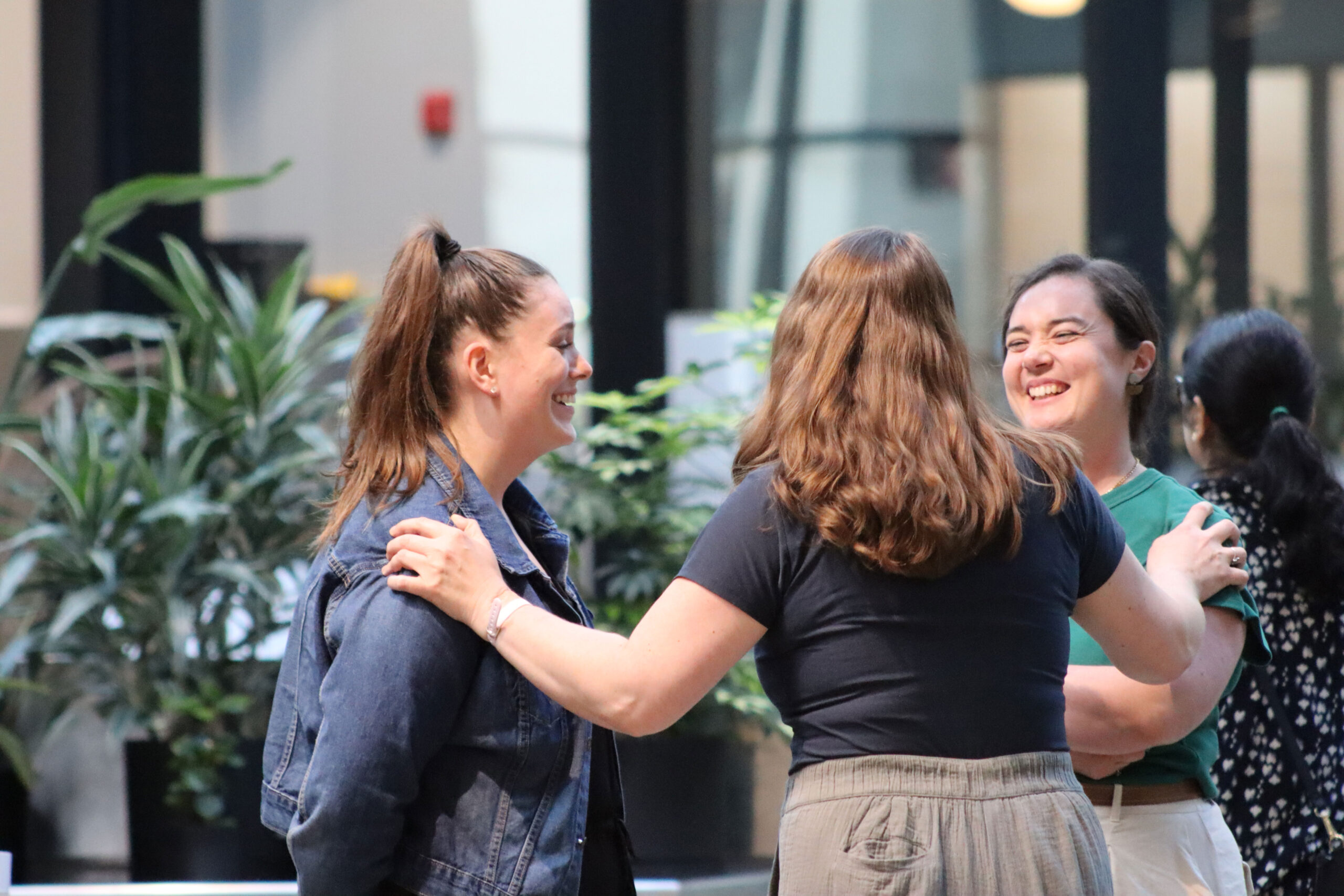 Founders laughing at an event.