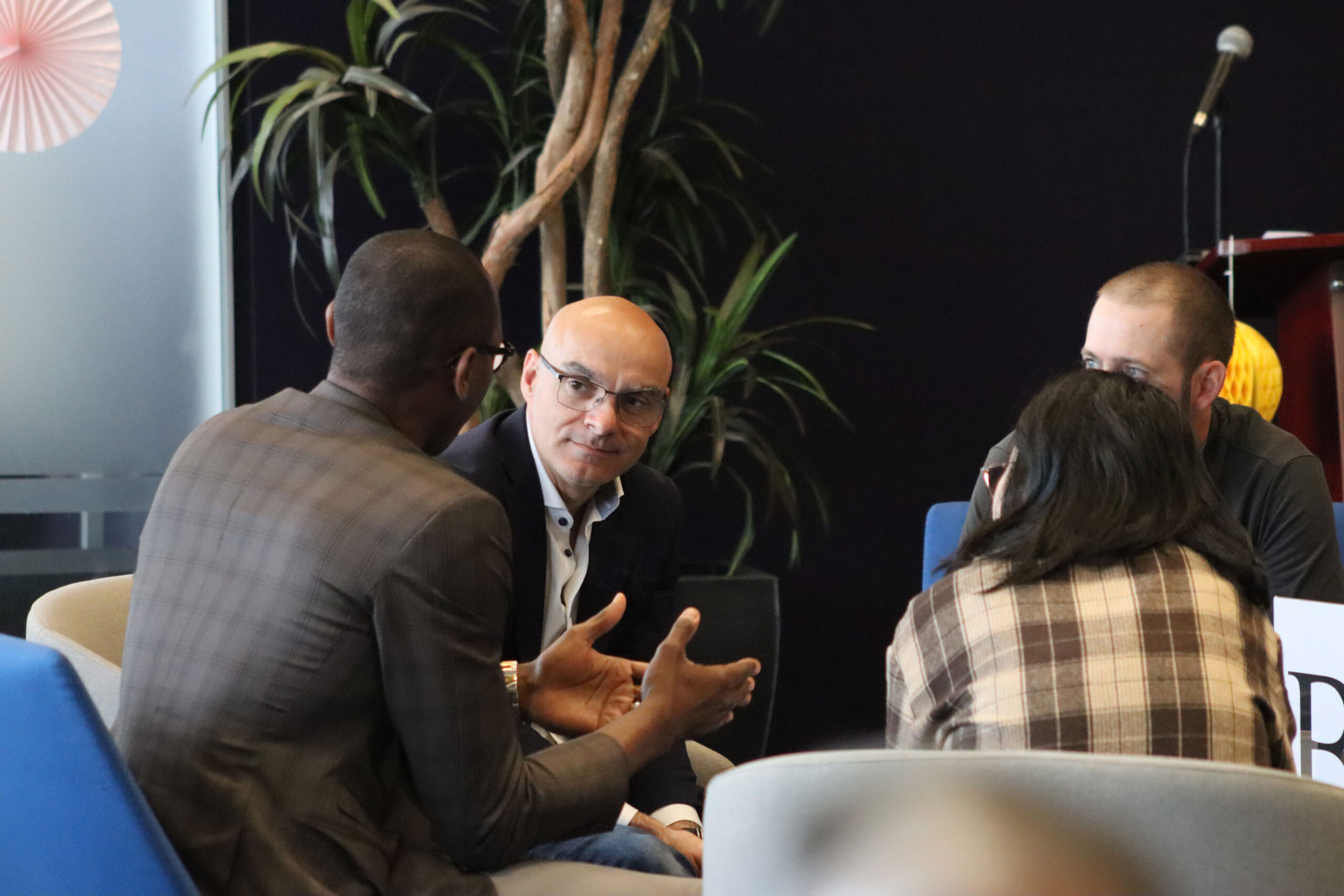 Founders and investors at an AC event.